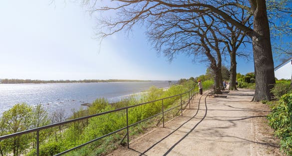 Footpath along the shore of the Elbe river in Wedel, Germany