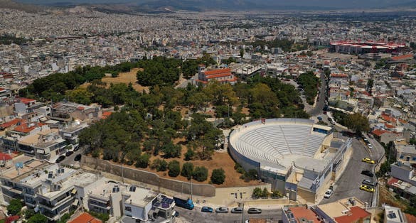 Photo of Aerial drone photo of famous ancient style theater of Veakio above round port of Mikrolimano and Zea, Piraeus, Attica, Greece.