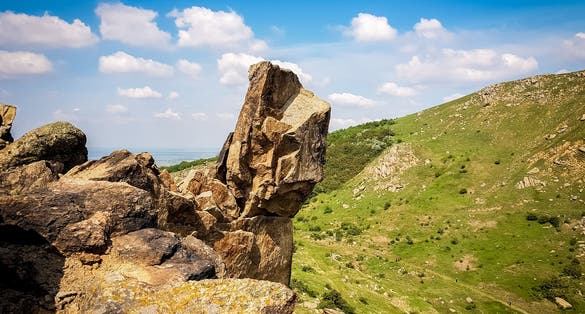 photo of view of "The Sfinx" Natural Monument from Macin Mountains reservation. Tulcea, Romania.