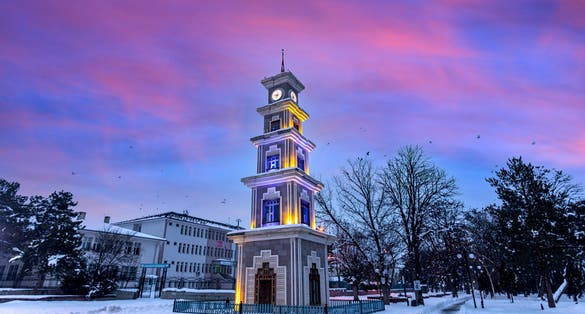 Photo of Clock tower in Erzincan Province snow gold and night exposure, Turkey.