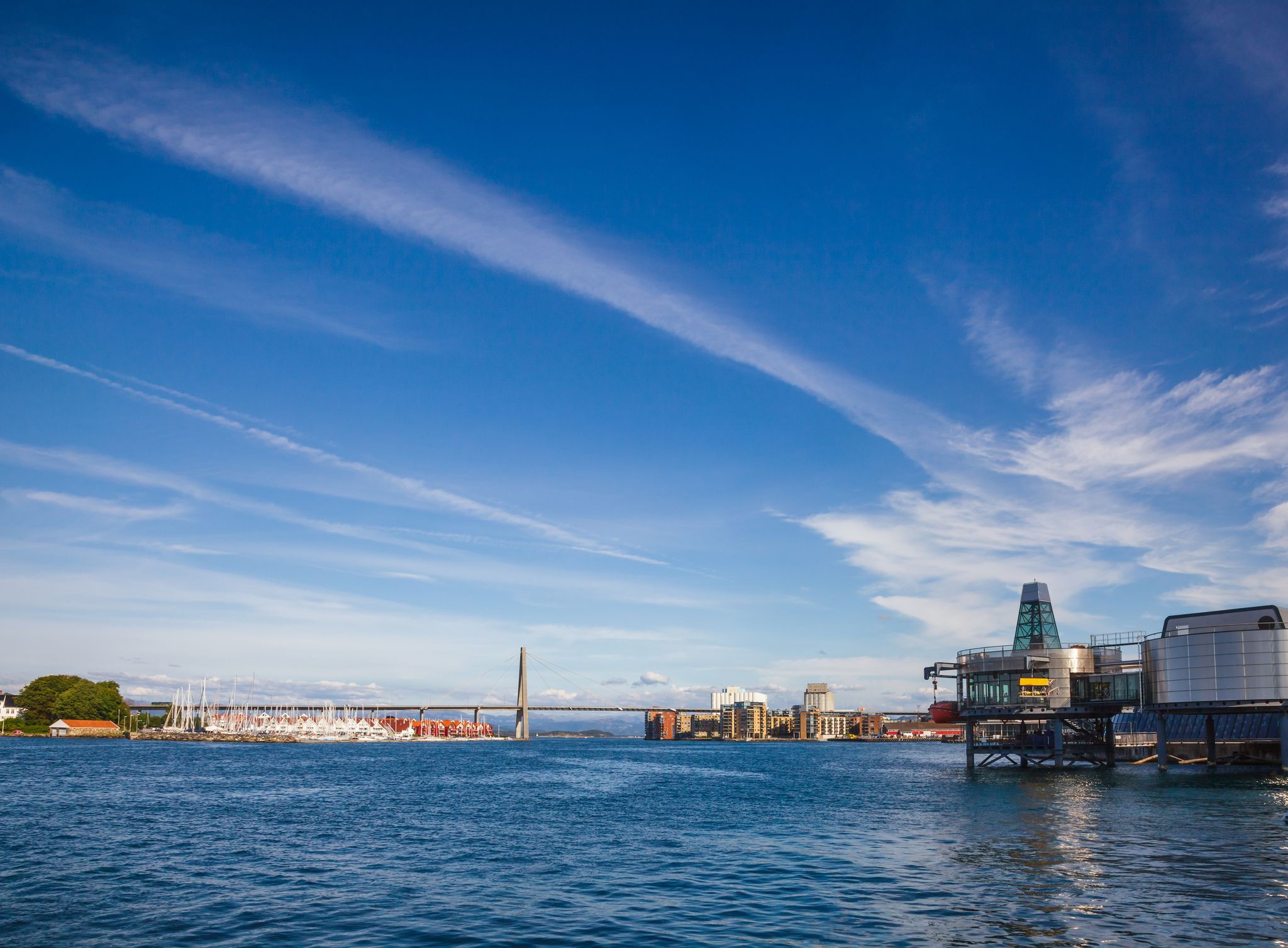 Panoramic view of Ostre Havn harbour of Stavanger at Byfjorden fjord with Grasholmen island, Stavanger City Bridge and Norwegian Petroleum Museum on a bright summer day, Norway, Scandinavia
