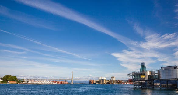 Panoramic view of Ostre Havn harbour of Stavanger at Byfjorden fjord with Grasholmen island, Stavanger City Bridge and Norwegian Petroleum Museum on a bright summer day, Norway, Scandinavia