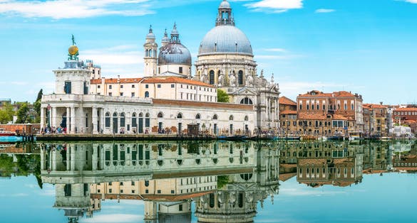 photo of Venice, Italy. Amazing view of Venice with mirror reflection in water. Panorama of old architecture of Venice at the Grand Canal. Beautiful summer scenery of the Venice city in summer.
