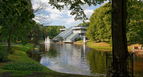 photo of kronvalda park in Riga, Latvia, with the port authority building in the background.