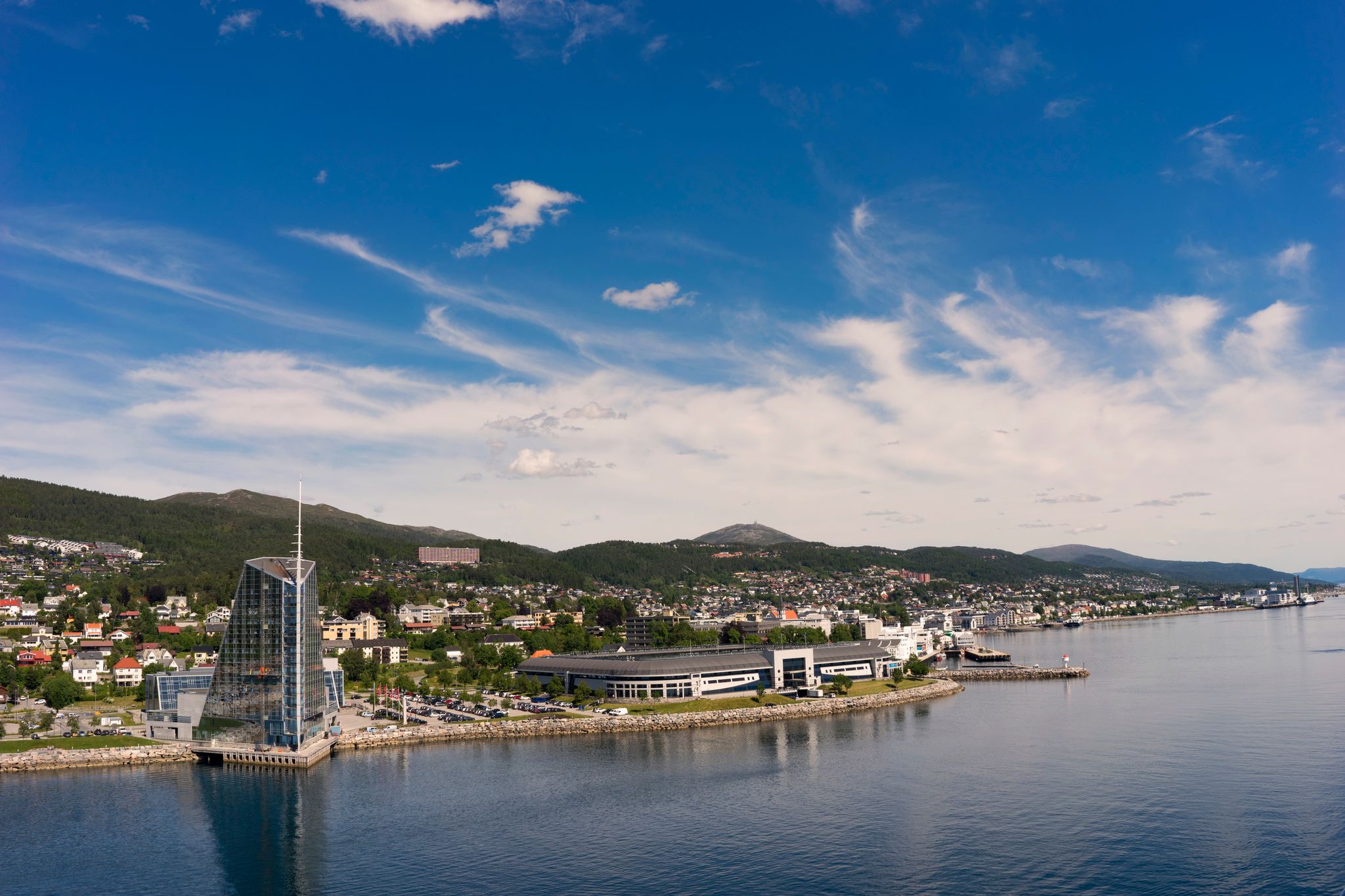 photo of view of Seaside view of Molde, Norway. The city is located on the northern shore of the Romsdalsfjord and is nicknamed ‘The Town of Roses’.