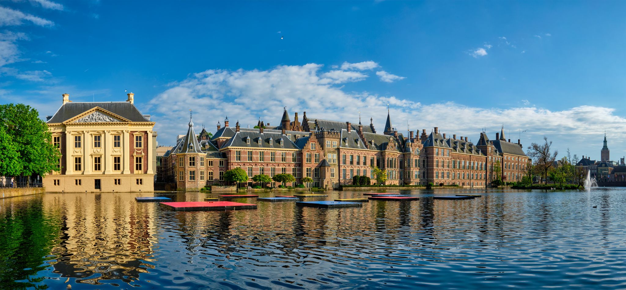 Photo of panorama of the Binnenhof House of Parliament and Mauritshuis museum and the Hofvijver lake, The Hague, Netherlands.