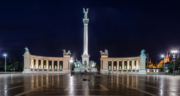 Photo of the historic Heroes Square at night in Budapest, Hungary.