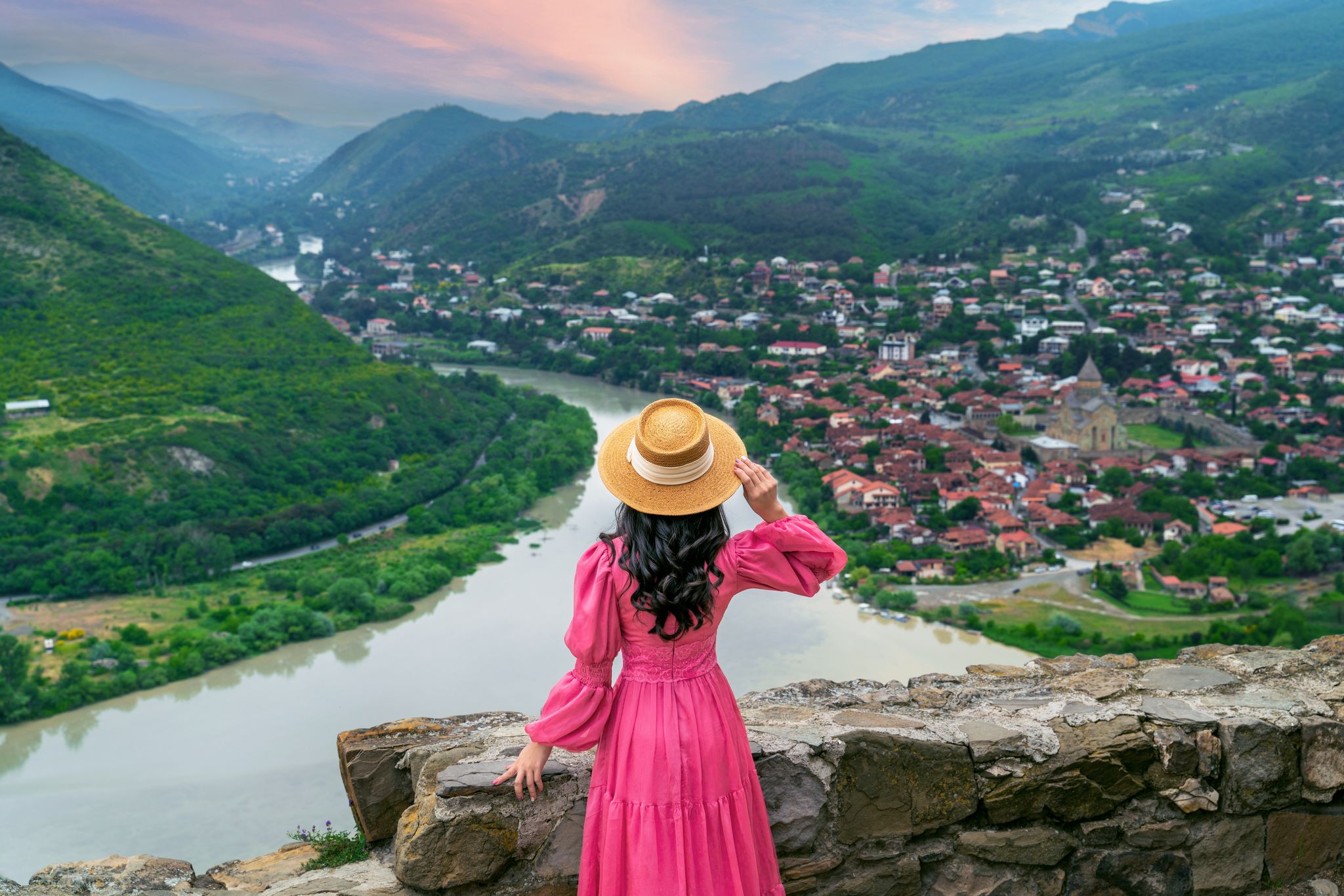Photo of tourist visiting Jvari Monastery and Mtskheta city in Georgia.