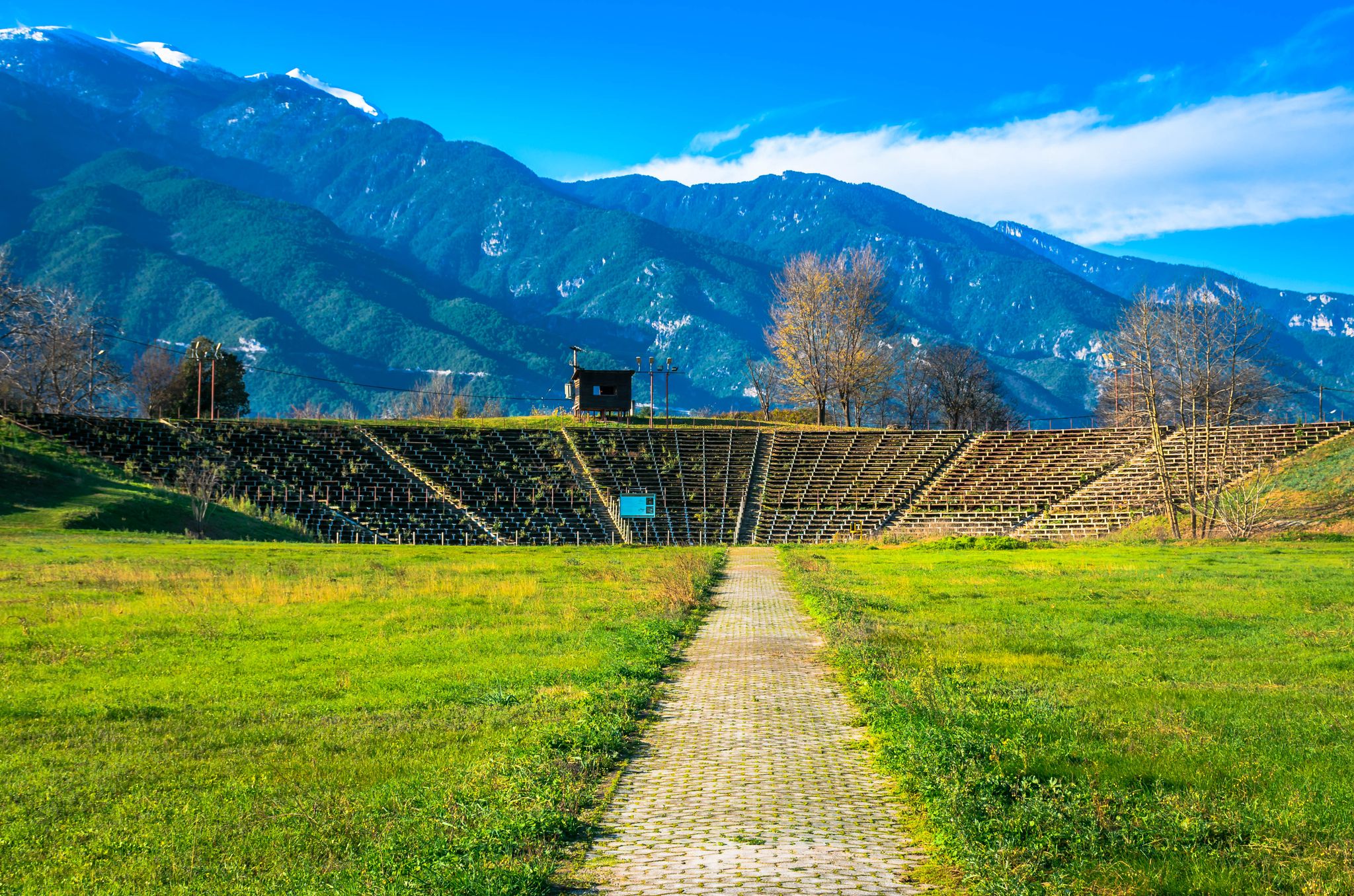 photo of View of Hellenistic Theater at the archaeological site of Dion situated in the northern foothills of Mount Olympus. Pieria, Macedonia, Greece.