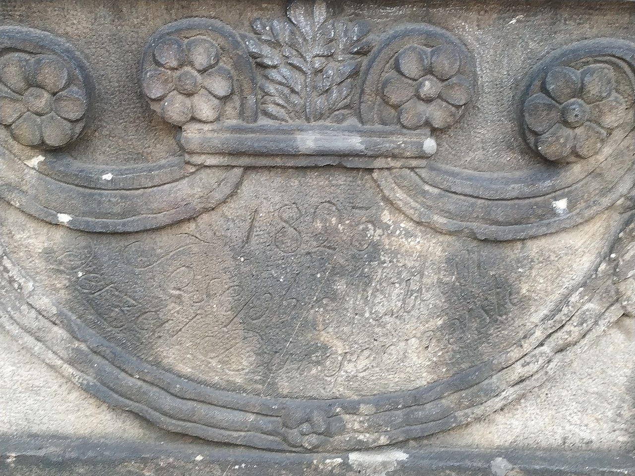 Photo of Field with German inscriptions on the side of the Fountain of Neptune in Liberec, Czechia.