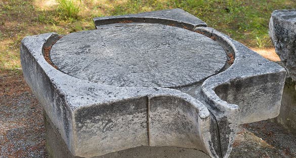 photo of view Ancient Greek or Roman piece of a wine- or olive-press, Lefkada, Greece.
