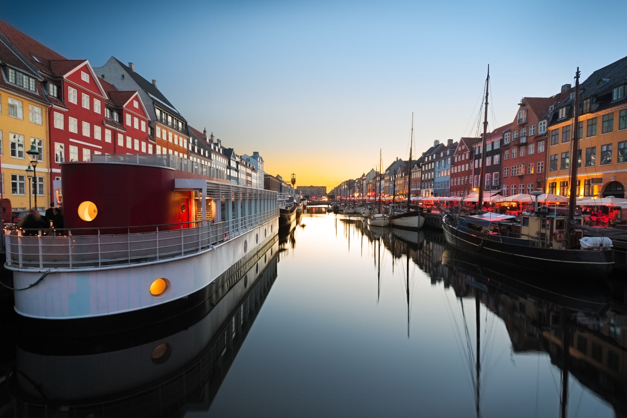Photo of Ships in Nyhavn at beautiful sunset, Copenhagen, Denmark.