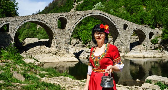 photo of  view of Traditional Dressed woman in Devils Bridge at Bulgaria,Diadovtsi bulgaria.