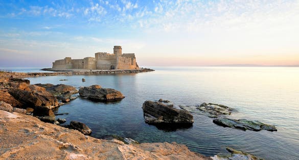 Photo of Isola di Capo Rizzuto, Crotone district, Le Castella, Italy, Calabria, view of the Aragonese castle at sunset.