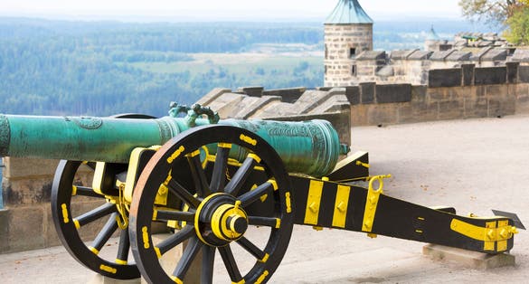 Medieval Königstein Fortress, located on a rocky hill above the Elbe River in Saxon Switzerland, cannon on the defensive walls, Königstein, Germany