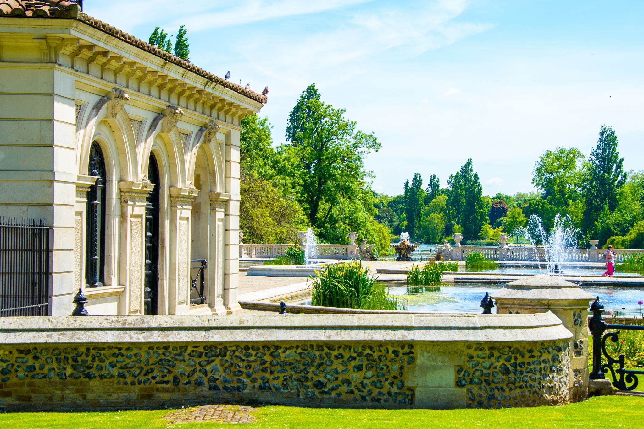 Photo of beautiful small house in the center of the Hyde park in London with pond and fountains, UK.