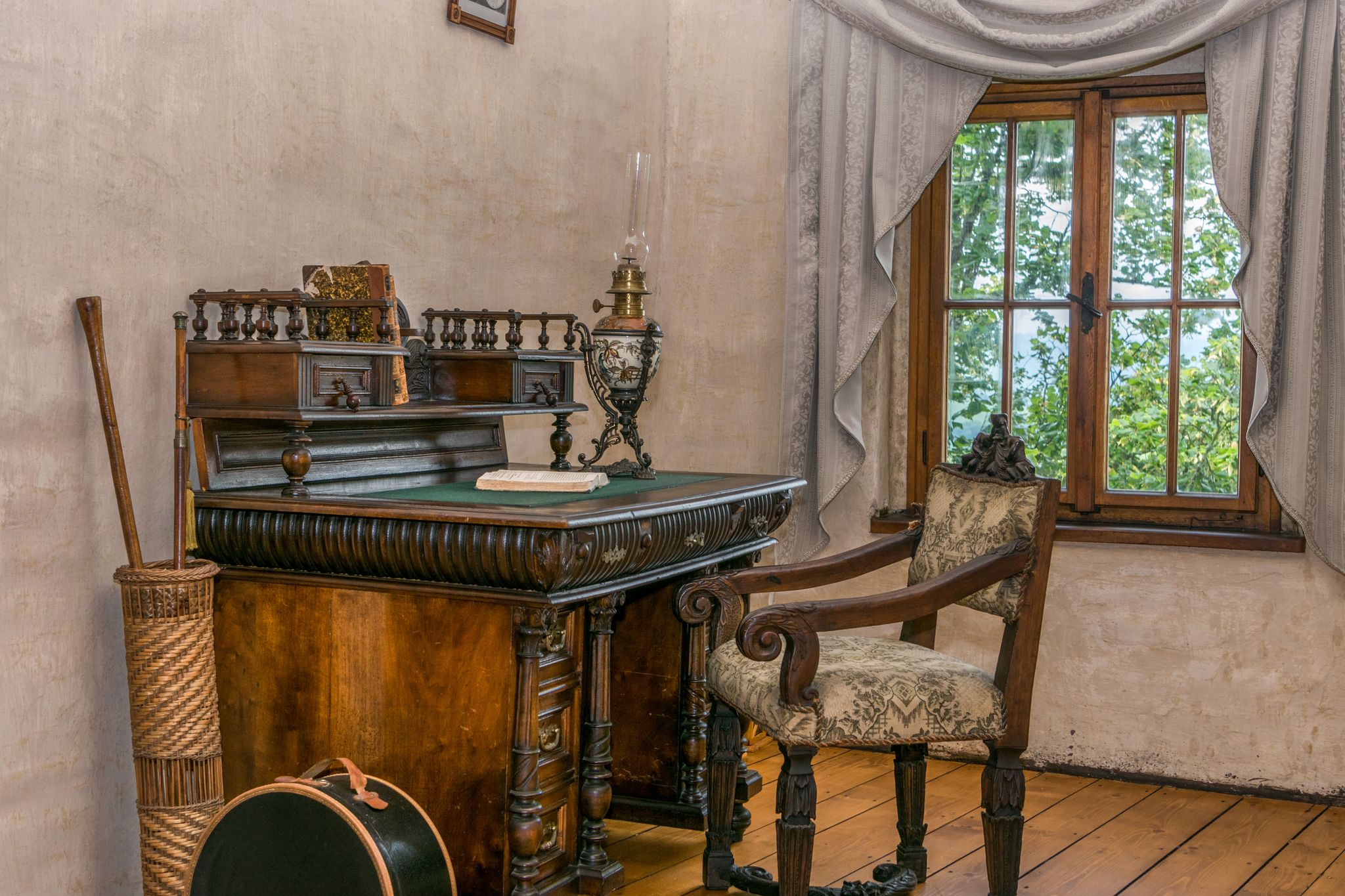 Medieval writing table with chair by the window