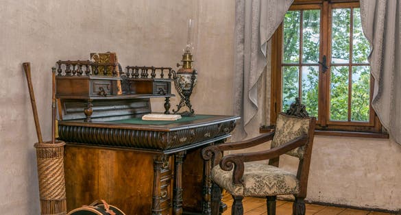 Medieval writing table with chair by the window