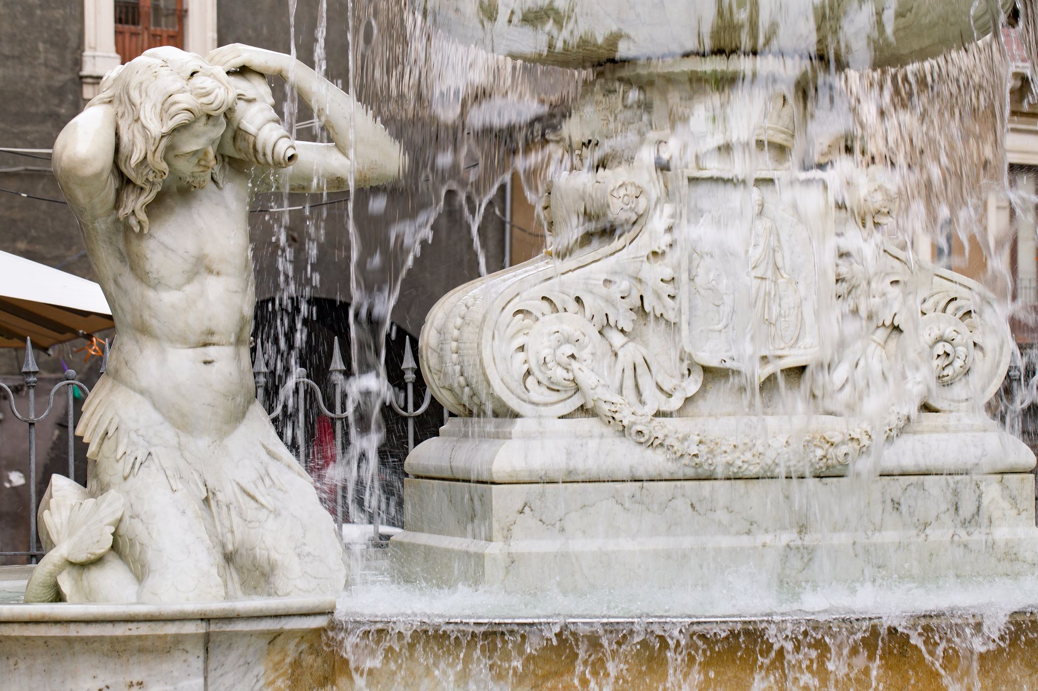 photo of Fountain in Catania, detail. (Fountain dell'Amenano) the central square of the city (Piazza Duomo). Sicily, Italy.