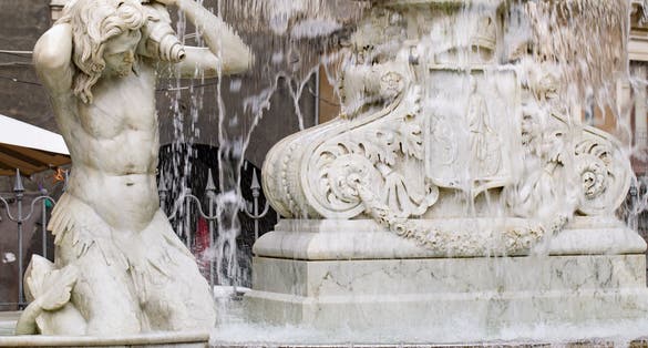 photo of Fountain in Catania, detail. (Fountain dell'Amenano) the central square of the city (Piazza Duomo). Sicily, Italy.