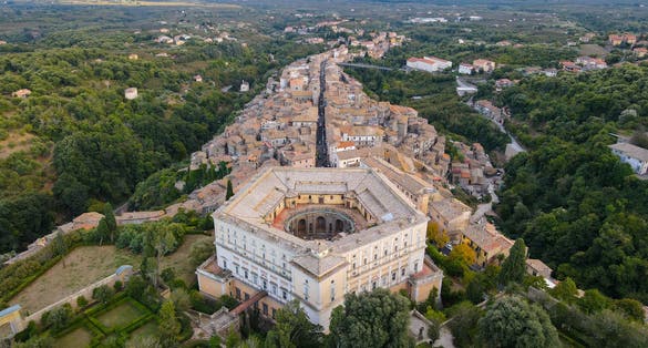 Aerial view of The Villa Farnese (in italian Palazzo Farnese), a mansion in the town of Caprarola, near Viterbo, Northern Lazio, Italy. Birds eye of the ancient village of Caprarola, in Tuscia.
