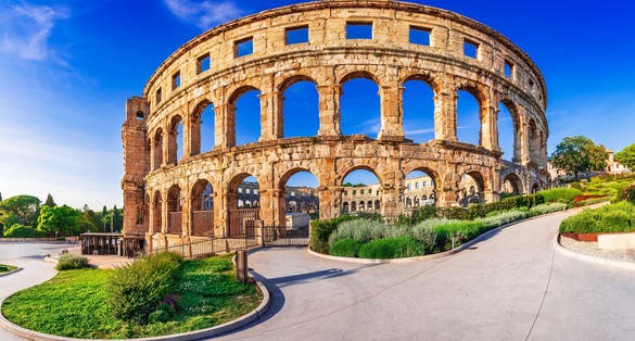 Photo of summer scenic view of ancient ruins Roman Amphitheatre in Pula, Istria croatian region.
