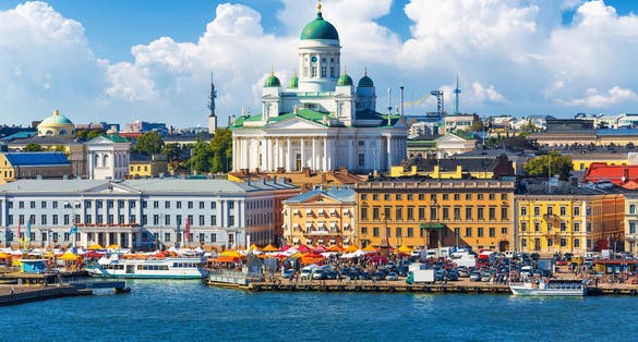 Photo of scenic summer panorama of the Market Square (Kauppatori) at the Old Town pier in Helsinki, Finland.
