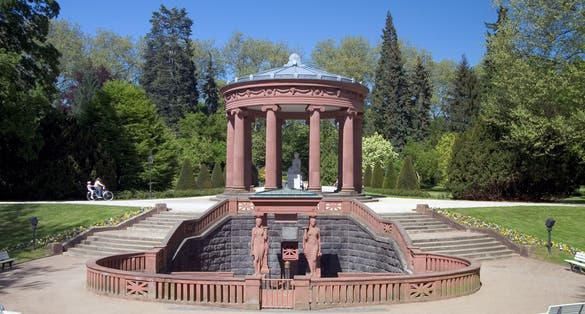 photo of view of Elaborate water fountain for drinking mineral water in the Kurpark, Bad Homburg - Germany.