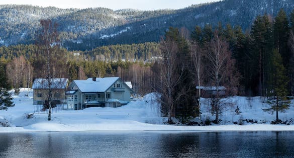 Abstract landscape in the mountains, with reflection of the forest in the river at Kongsberg, Norway.