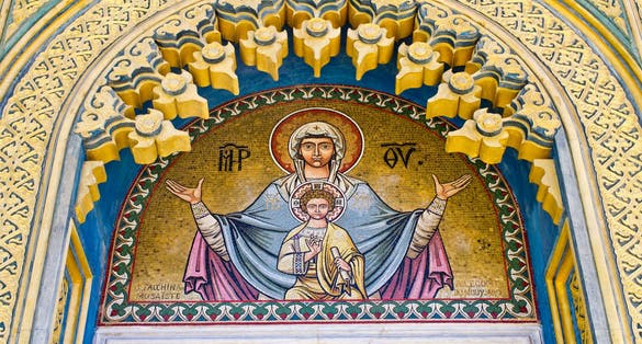 Photo of decorated door of the church in Curtea de Arges, Romania.