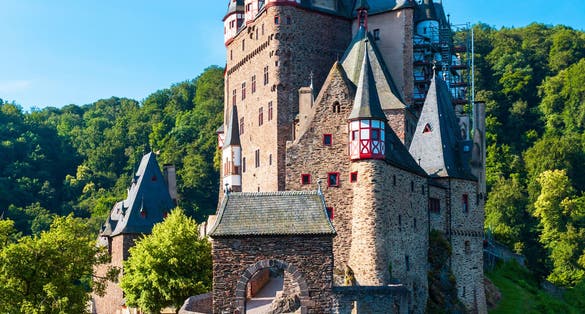 photo of view of Eltz Castle or Burg Eltz. Medieval castle on the hills above the Moselle River. Rhineland-Palatinate Germany.