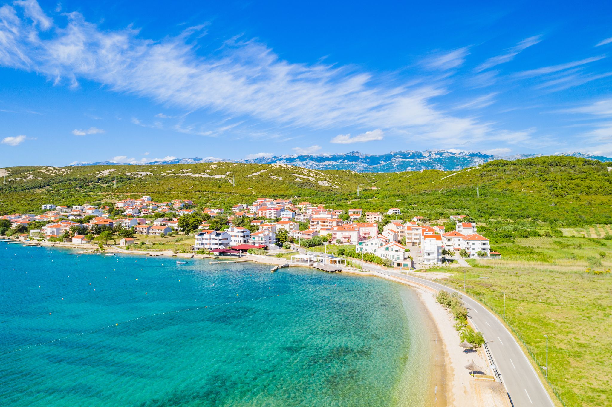 Croatia, beautiful Adriatic coastline, town of Stara Novalja on the island of Pag, aerial view from drone