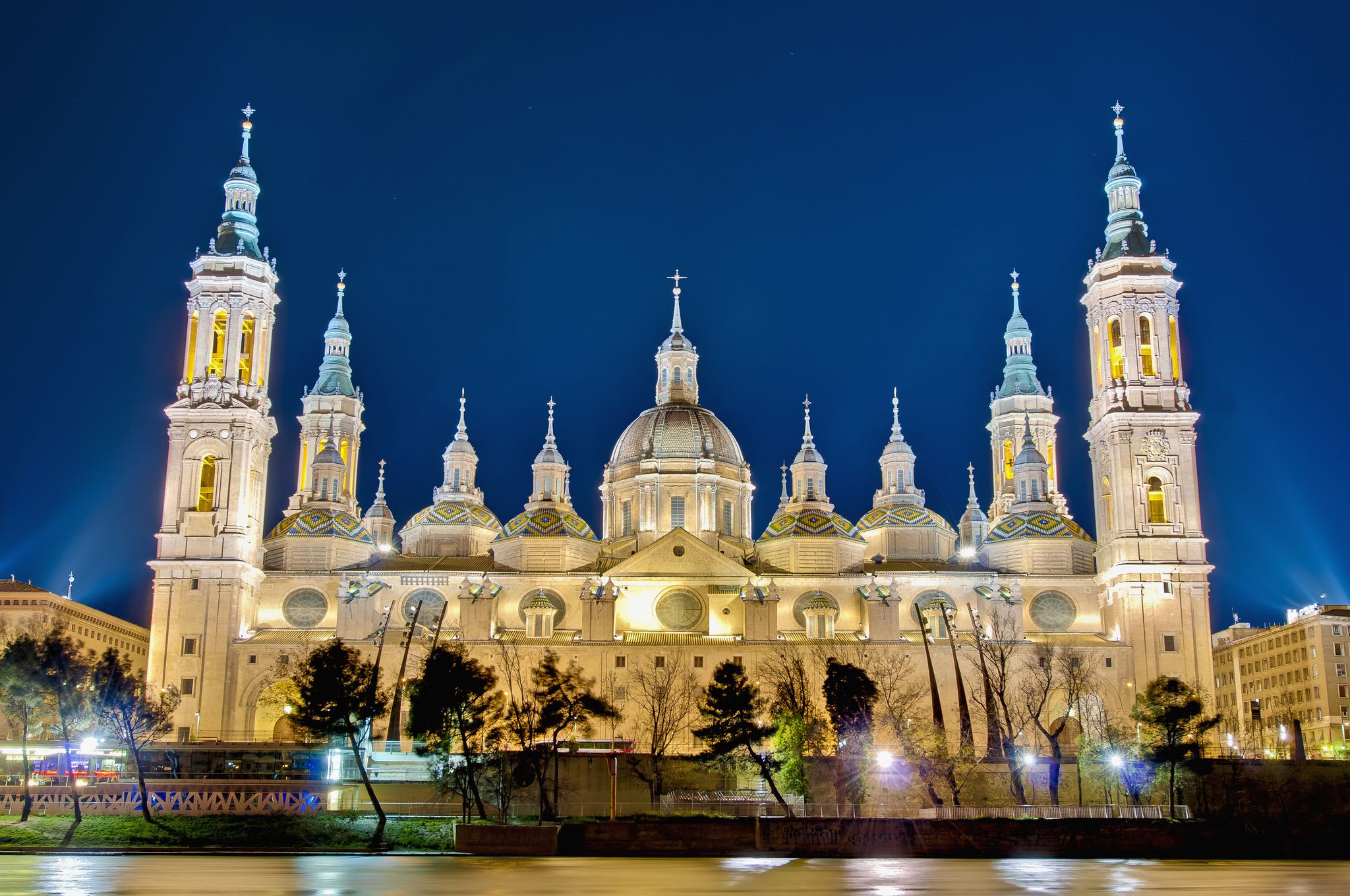 Photo of Our Lady of the Pillar Basilica as seen from the north shore at night of Ebro River at Zaragoza, Spain