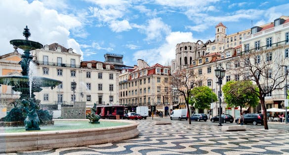 Photo of Rossio square with fountain located at Baixa district in Lisbon, Portugal.