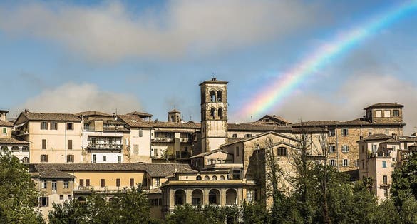 photo of a rainbow with panorama of Rieti in Italy.