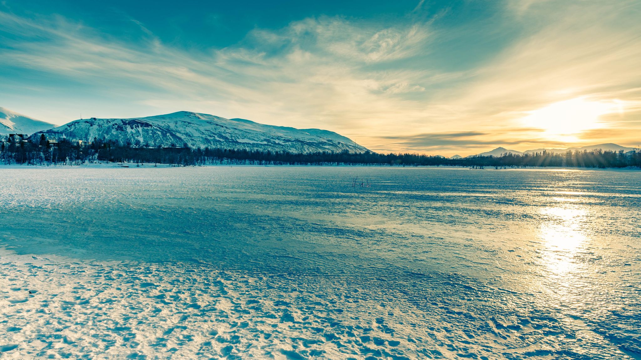 It was 1pm when we took this shot on the frozen Prestvannet Lake in Tromsø. The sun was high in the sky! The colors were magical...