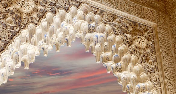 Photo of Arches in Islamic (Moorish) style in Alhambra, Granada, Spain .
