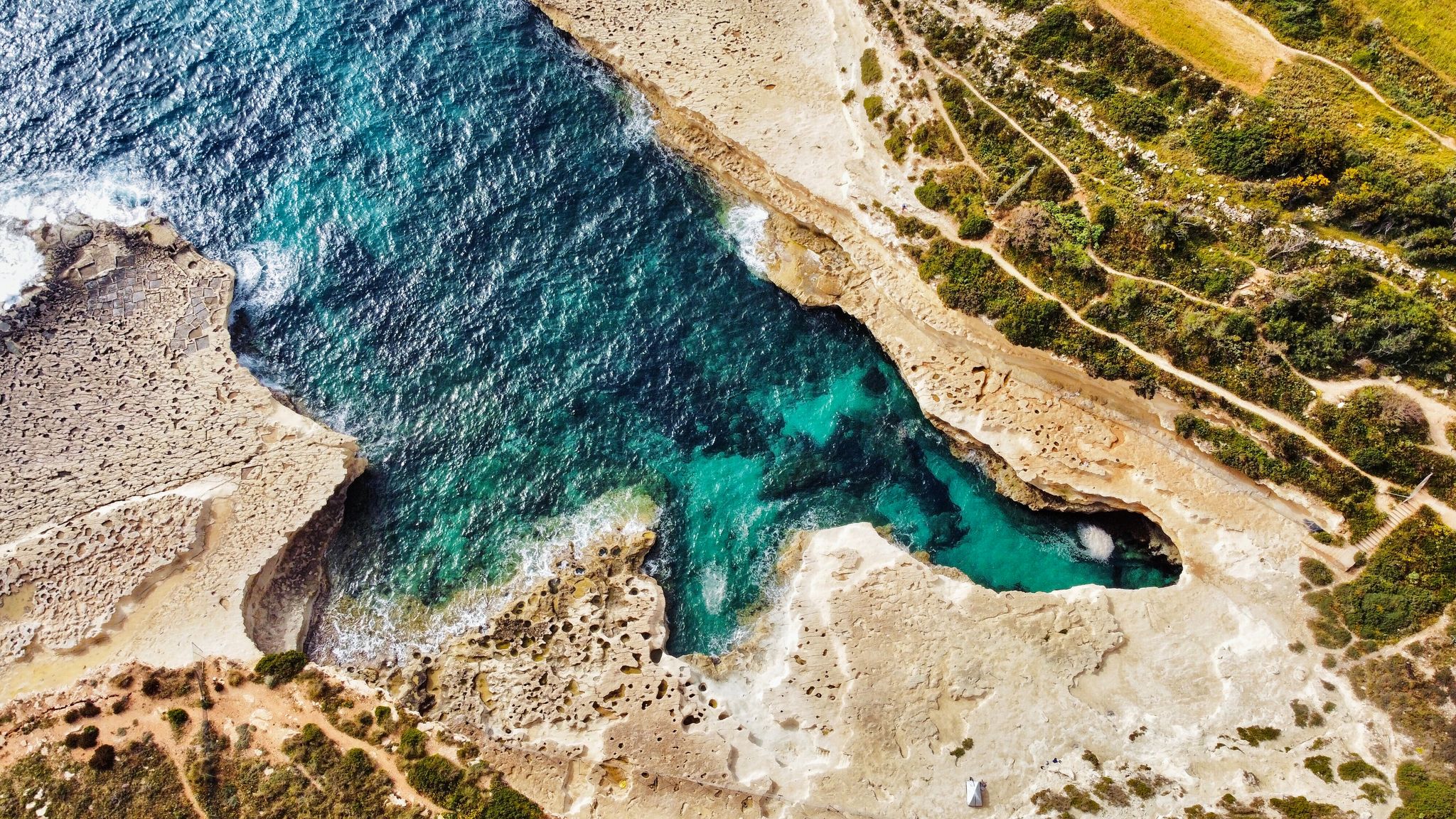 Photo of birds eye view of St Peter's Pool, Malta.