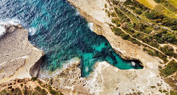 Photo of birds eye view of St Peter's Pool, Malta.