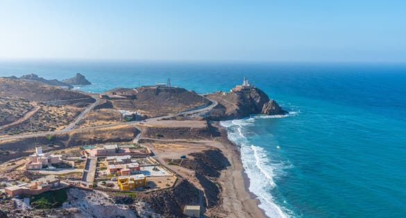 photo of aerial view of Cabo de Gata lighthouse panoramic view on the coastline of Cabo de Gata-Nijar Natural Park, Almería, Spain.