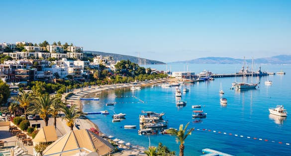Photo of View of Bodrum Beach, Aegean sea, traditional white houses, flowers, marina.