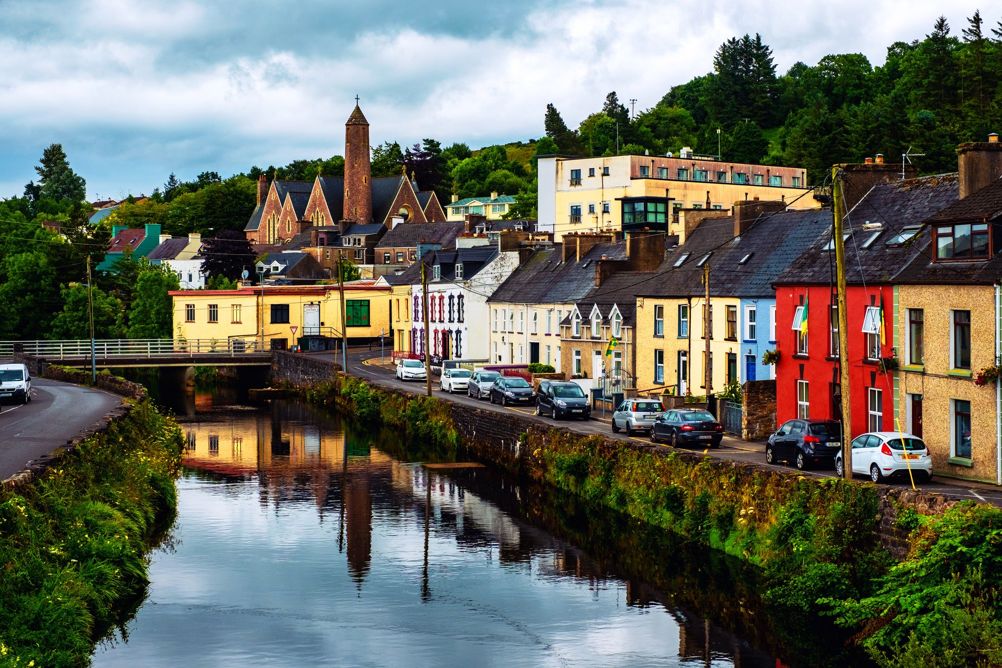 Photo of beautiful landscape in Donegal, Ireland with river and colorful houses.