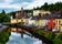 Photo of beautiful landscape in Donegal, Ireland with river and colorful houses.