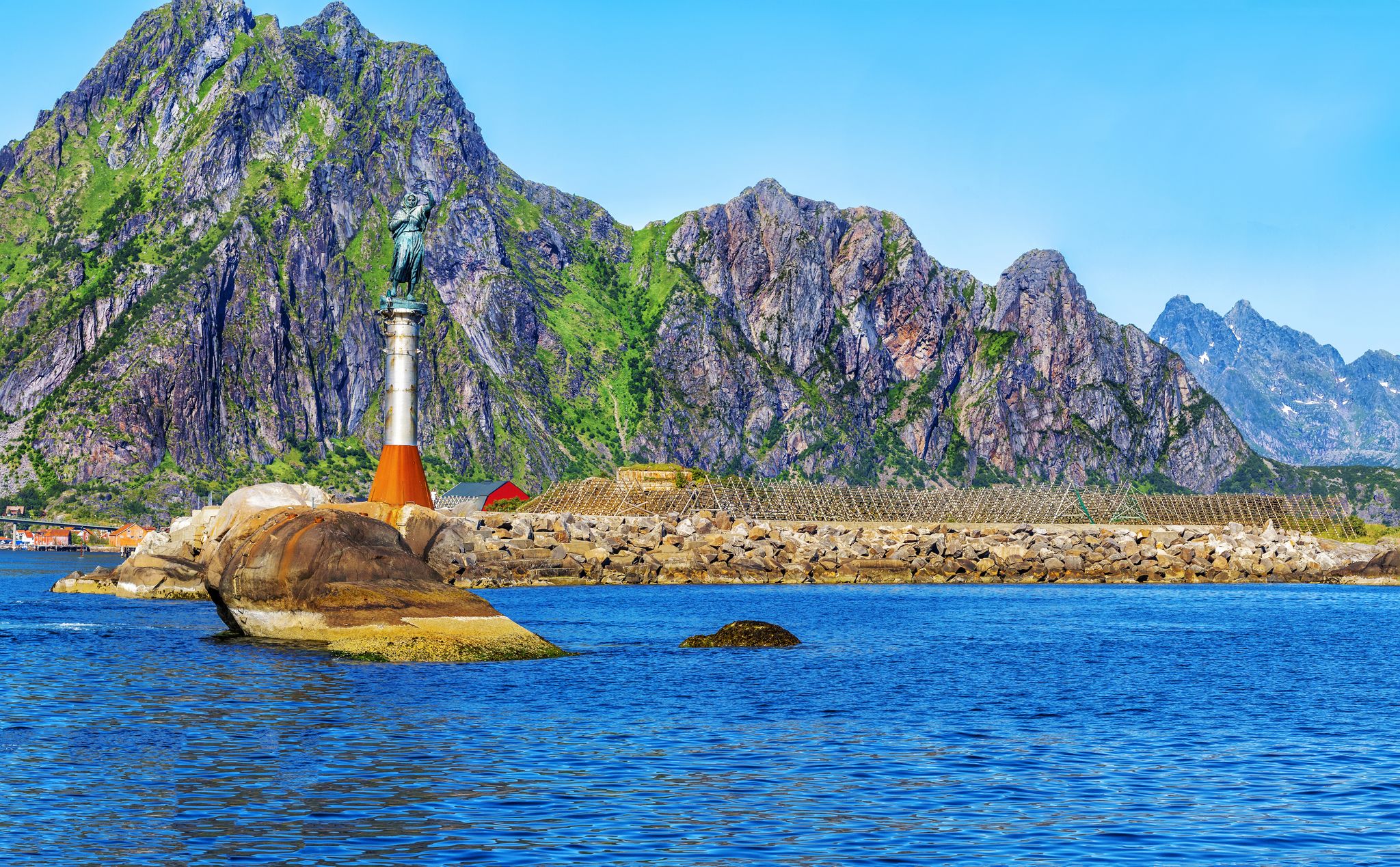 Photo of Svolvaer harbour with Statue of the Fisherman's wife in the Lofoten Islands