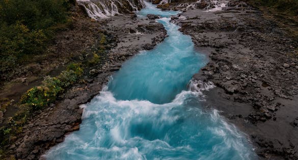 photo of aerial view of the Icelandic waterfall Brúarfoss.