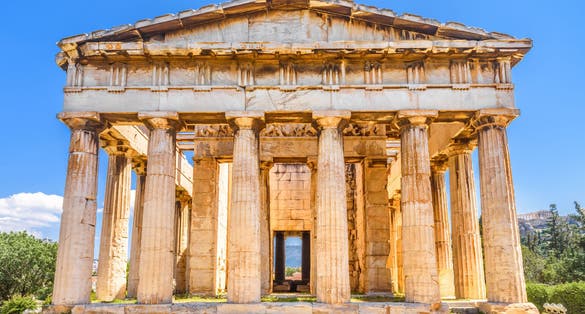 Photo of Temple of Hephaestus in Ancient Agora, Athens, Greece. Sunny front view of classical Greek temple.