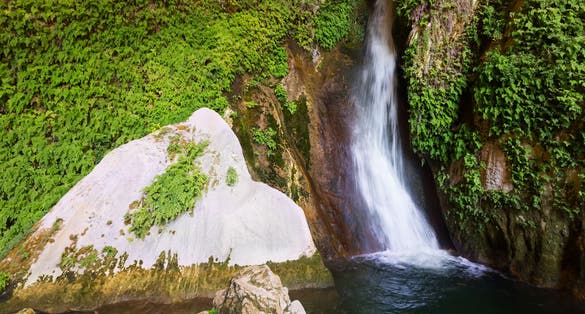 Photo of Waterfall in natural grot. Cuerva dal Agua near Tiscar. Spain .