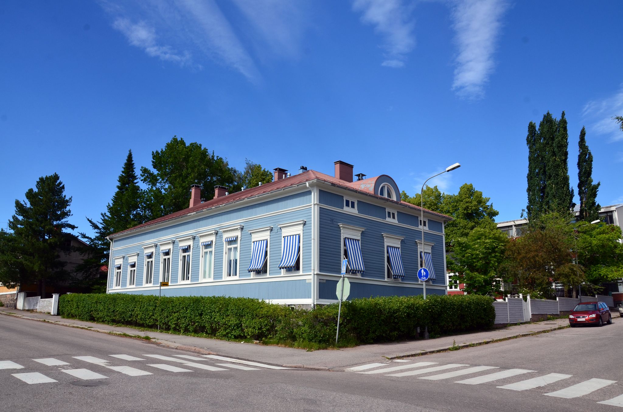 Ancient wooden houses in the center of Porvoo in Finland at sunset in summer against the blue sky