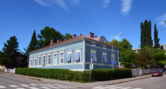 Ancient wooden houses in the center of Porvoo in Finland at sunset in summer against the blue sky