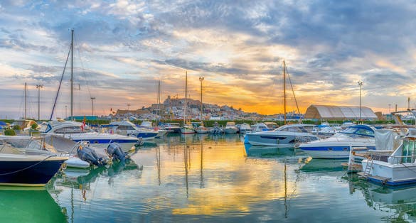 Photo of landscape with Eivissa harbour at sunset time, Ibiza island, Spain.